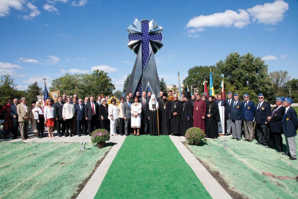 All dignitaries in front of Monument - Community Chronicle