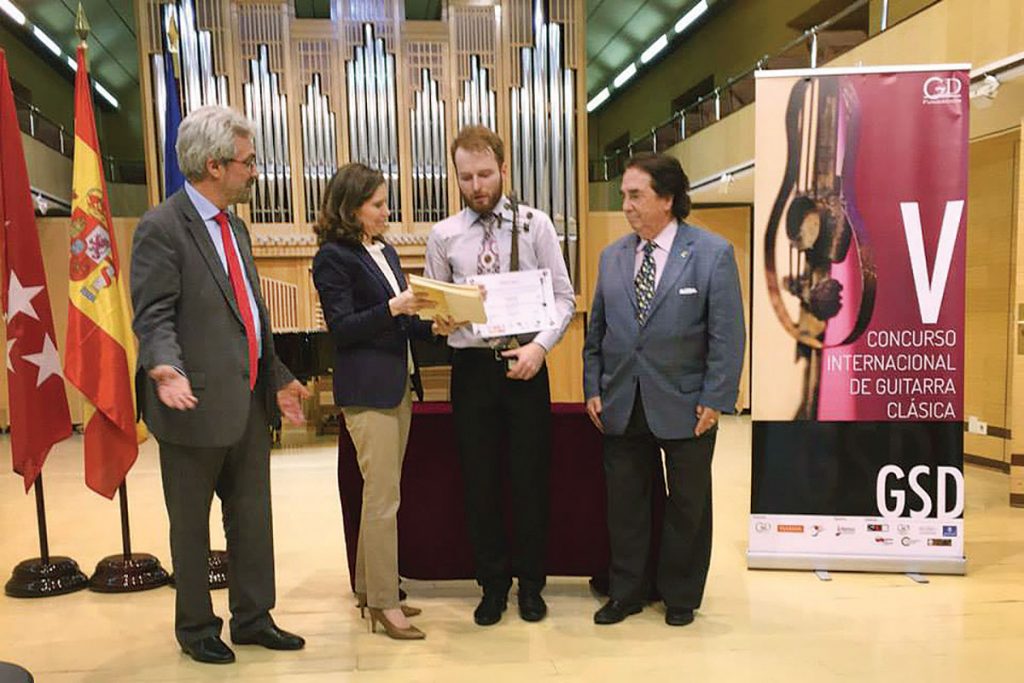Marko Topchii receives the first place award at the San Diego guitar competition - Generation Uke