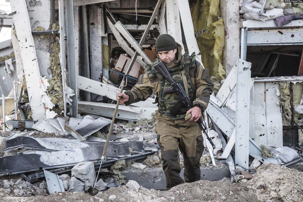 Ukrainian soldier searching for dead bodies at Donetsk airport in October 2015
