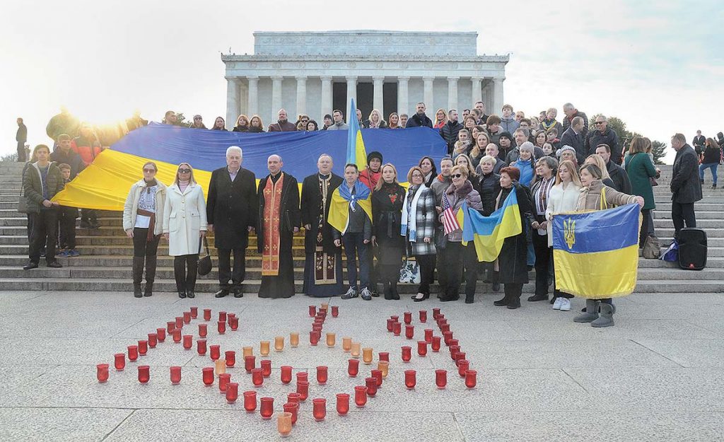 Members of the Ukrainian American community commemorate the Heavenly Hundred in front of the Lincoln Memorial