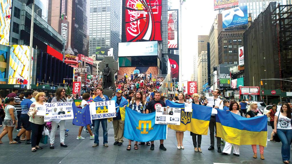 NEW YORK – The New York branch of the Ukrainian Congress Committee of America organized a protest against the sentencing of filmmaker Oleh Sentsov to a 20-year term in a maximum-security prison on trumped-up charges of terrorism. The sentence was handed down by a Russian court in Rostov-in-Don. Dozens of demonstrators with flags and placards gathered in Times Square on August 30 to demand freedom for Mr. Sentsov and his co-defendant Oleksandr Kolchenko.